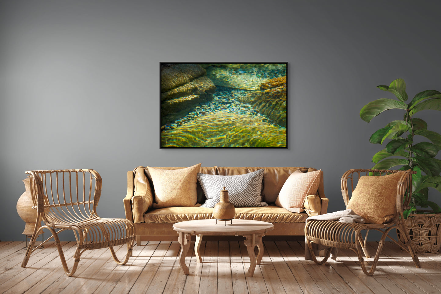 Living room with wicker furniture, a sofa, and a framed nature print on the wall of a crystal clear, glittering, stone-bottom river.